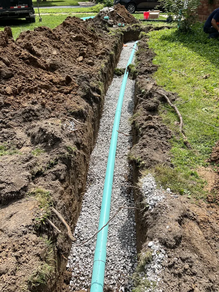 Sewer pipe installed in an outdoor trench by A Plus Plumbing
